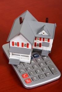 House with a calculator - calculating housing costs